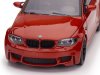 Масштабная модель BMW 1-й серии M Coupe E82 2011 оранжевый металлик 1:43 Minichamps 940020120 ракурс 4