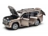 Масштабная модель Toyota Land Cruiser 300-ZX 2024 золотистый металлик ракурс 2