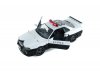 Масштабная модель Nissan Skyline GT-R (R34) 1999 полиция Японии, белый с черным 1:18 Solido S1804317 ракурс 3