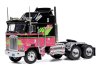 Масштабная модель Kenworth K100 Aerodyne 1976 седельный тягач чёрный с розовым и зеленым 1:64 IXO U64TR006