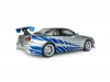 Масштабная модель Nissan Skyline GT-R (BNR34) (1999) Брайана ОКоннера из фильма Двойной форсаж, серебристый с синим 1:18 Solido S1804315A ракурс 2