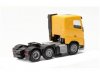 Масштабная модель Volvo FH FD седельный тягач 6x2 (2020) жёлтый 1:87 Herpa 313735 ракурс 2