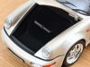 Масштабная модель Porsche 911 Carrera 2 Turbo Look кабриолет (964) 1992 серебристый металлик ракурс 3